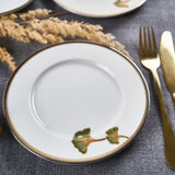 Zsolnay Autumn porcelain dinner plate featuring hand-painted ginkgo leaves and 18K gold accents.