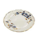 A white porcelain serving platter decorated with blue floral motifs and gold accents, set against a plain white background.