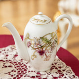 Decorative teapot with floral designs on a lace doily