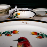 Dishes with floral patterns and 'Rimini' branding on a dark background