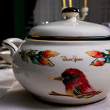 Decorative ceramic pot with bird design on a table setting