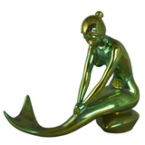 Green metallic mermaid figurine on a white background