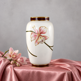 white vase with pink orchid flower 