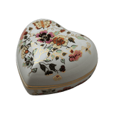 Zsolnay Butterfly hand-painted porcelain heart-shaped bonbonier with lid, featuring pink and yellow floral motifs, a butterfly, and gold accents, isolated on a transparent background.